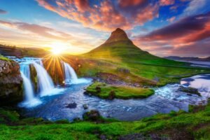 Gorgeous landscape with rising sun on Kirkjufellsfoss waterfall