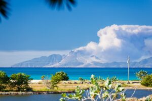 View to the active volcano in Montserrat with a large ash cloud.