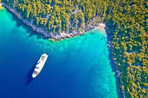 Aerial view of yacht on vibrant blue waters of Losinj, Croatia